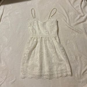White lace mini dress with pearl straps